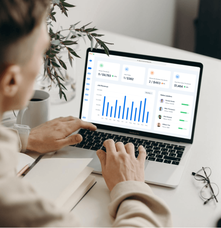 laptop on desk showing Smart Moving backend dashboard