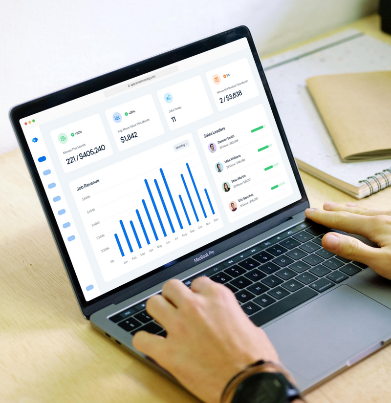 laptop on desk showing Smart Moving backend dashboard